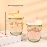 A cup with a straw made of letters