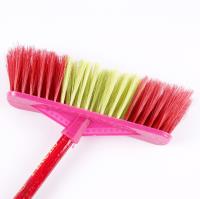 A two-color small wooden-handled broom