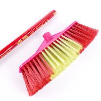 A two-color small wooden-handled broom