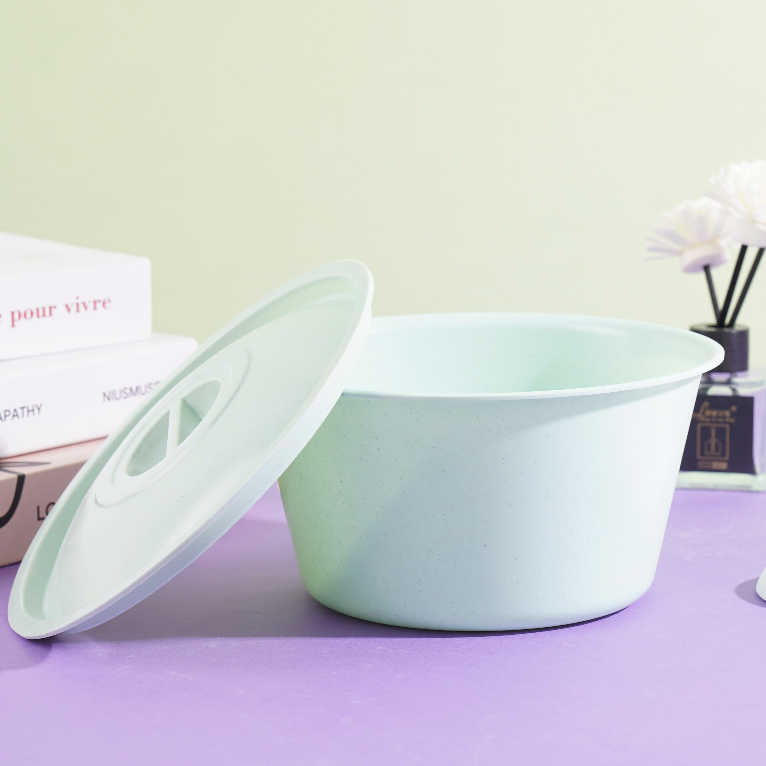 A ceramic-look covered teacup