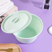 A ceramic-look covered teacup