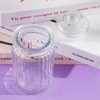 A large vertical striped glass bottle