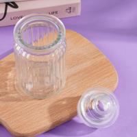 A large vertical striped glass bottle