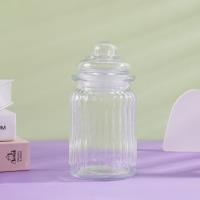 A large vertical striped glass bottle