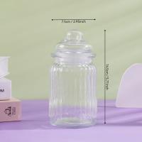 A large vertical striped glass bottle