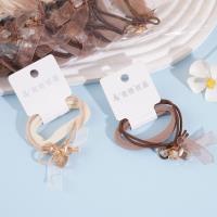 2 crystal ribbons combined with a headband and a rubber band