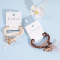 2 crystal ribbons combined with a headband and a rubber band