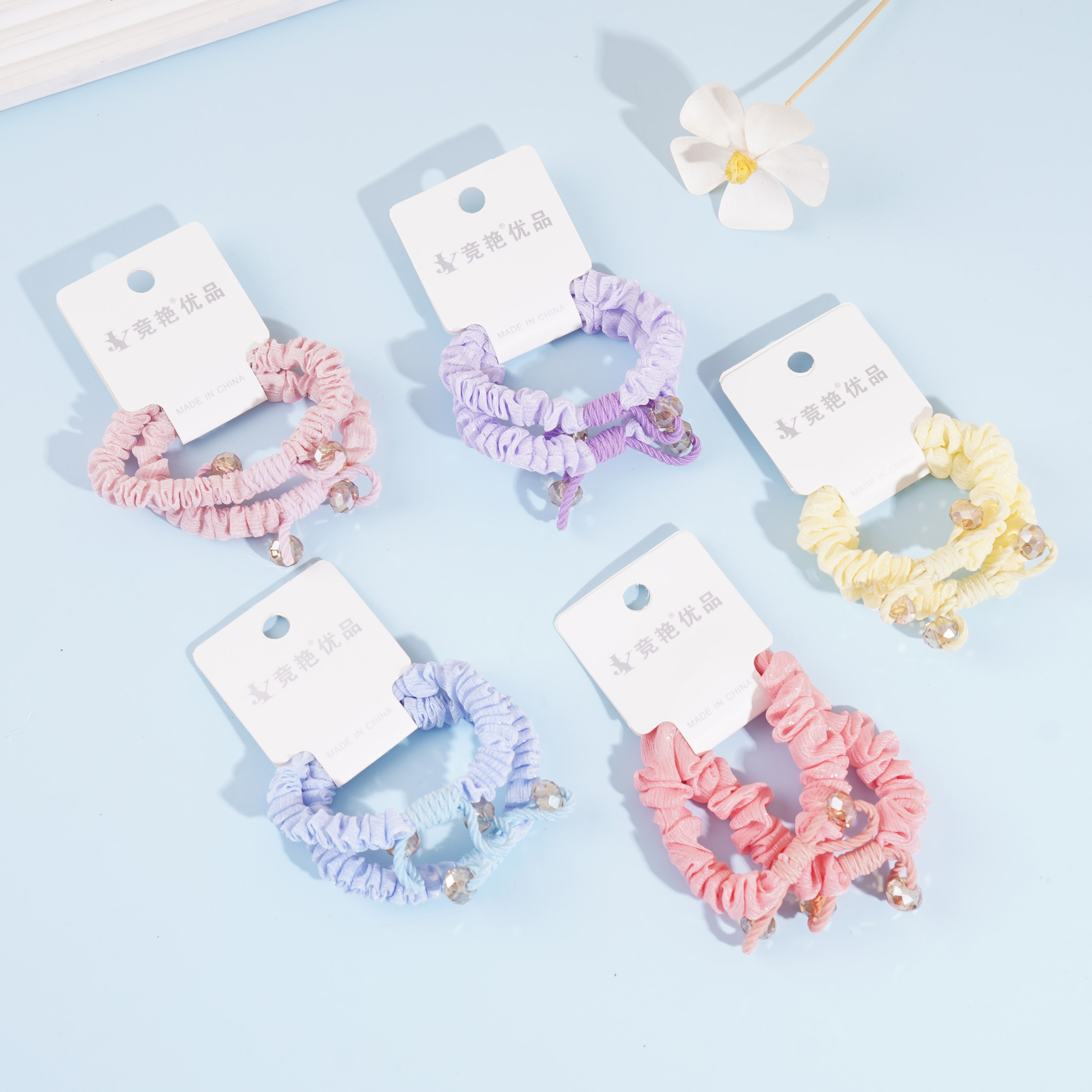 2 colorful knotted crystal headbands with elastic bands