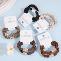 2 hollow elastic bands with semi-drilled bead heads and a string of beads on each end