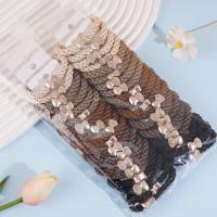 2 hollow elastic bands with semi-drilled bead heads and a string of beads on each end