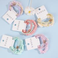 A set of three square braids with rectangular diamonds, combined with colorful headbands and rubber bands