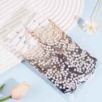 2 large pearl-headed rubber bands with a rose knot design