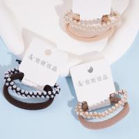 سوار رأس مكون من 2 ضفائر مزينة بأحجار اللآلئ المتراصة، مع شريط مطاطي لتثبيته.