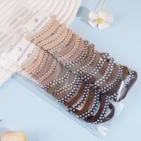 سوار رأس مكون من 2 ضفائر مزينة بأحجار اللآلئ المتراصة، مع شريط مطاطي لتثبيته.