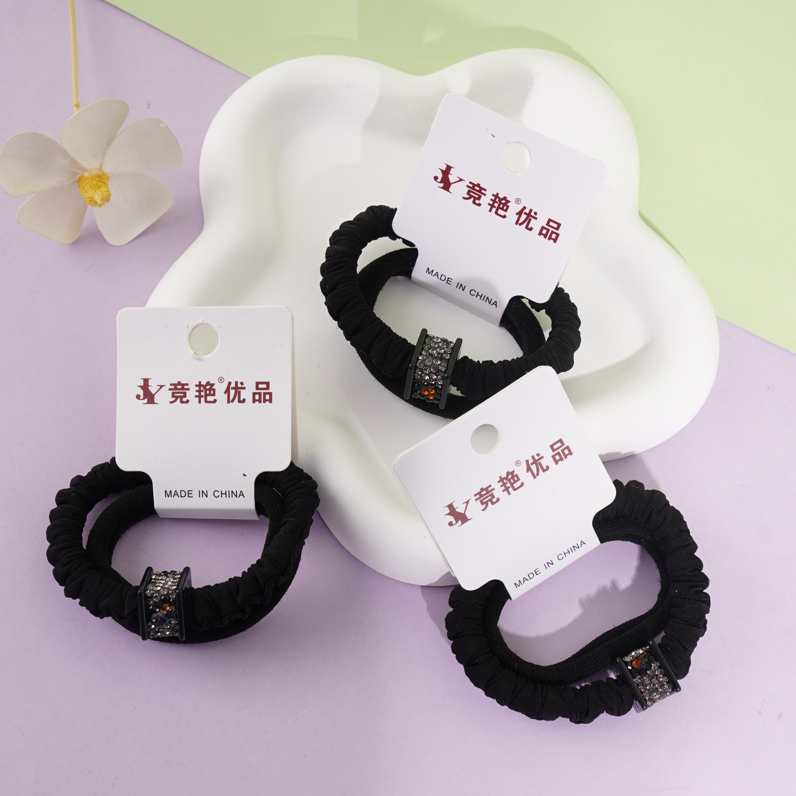 2 square diamond-shaped ponytail holders with leopard print and elastic bands