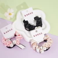 2 pieces of heat-pressed diamond-embroidered ribbons with pearls, small intestine-shaped ropes, and rubber bands