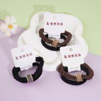 2 square-shaped diamond rings with small round diamonds and elastic bands