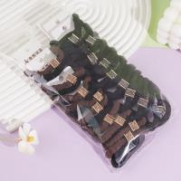 2 square-shaped diamond rings with small round diamonds and elastic bands