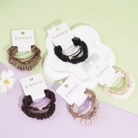 A set of three heart-shaped gold beads, featuring a delicate design, paired with a headband and elastic bands