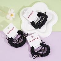 A set of three delicate bow-shaped headbands and elastic bands (black)