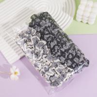 2 pieces of black and white striped small intestine-shaped ropes with elastic bands at the ends