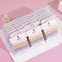 4 colored towel rings in a box