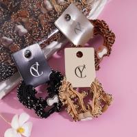 2 bow-tie headbands and rubber bands