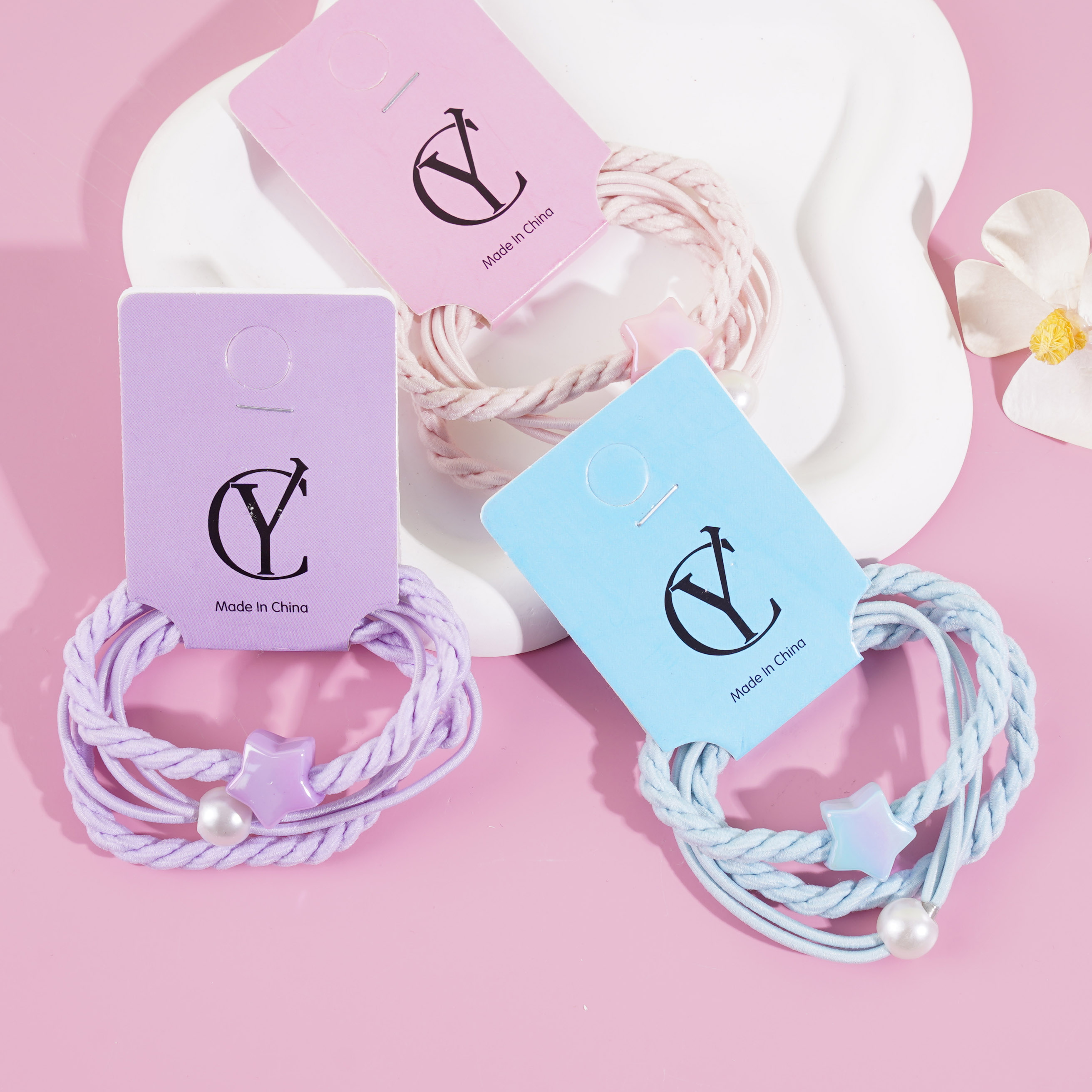 3 colorful star-shaped rubber bands for hair ties