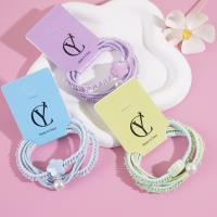 3 colorful flower-shaped headbands with elastic bands