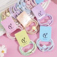 3 colorful flower-shaped headbands with elastic bands