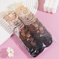 A set of three heart-shaped bear-themed headbands and rubber bands