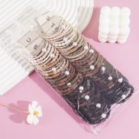 A set of four crystal pearl combination headbands and elastic bands