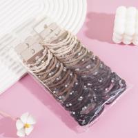 A set of three small pearl headbands with elastic bands