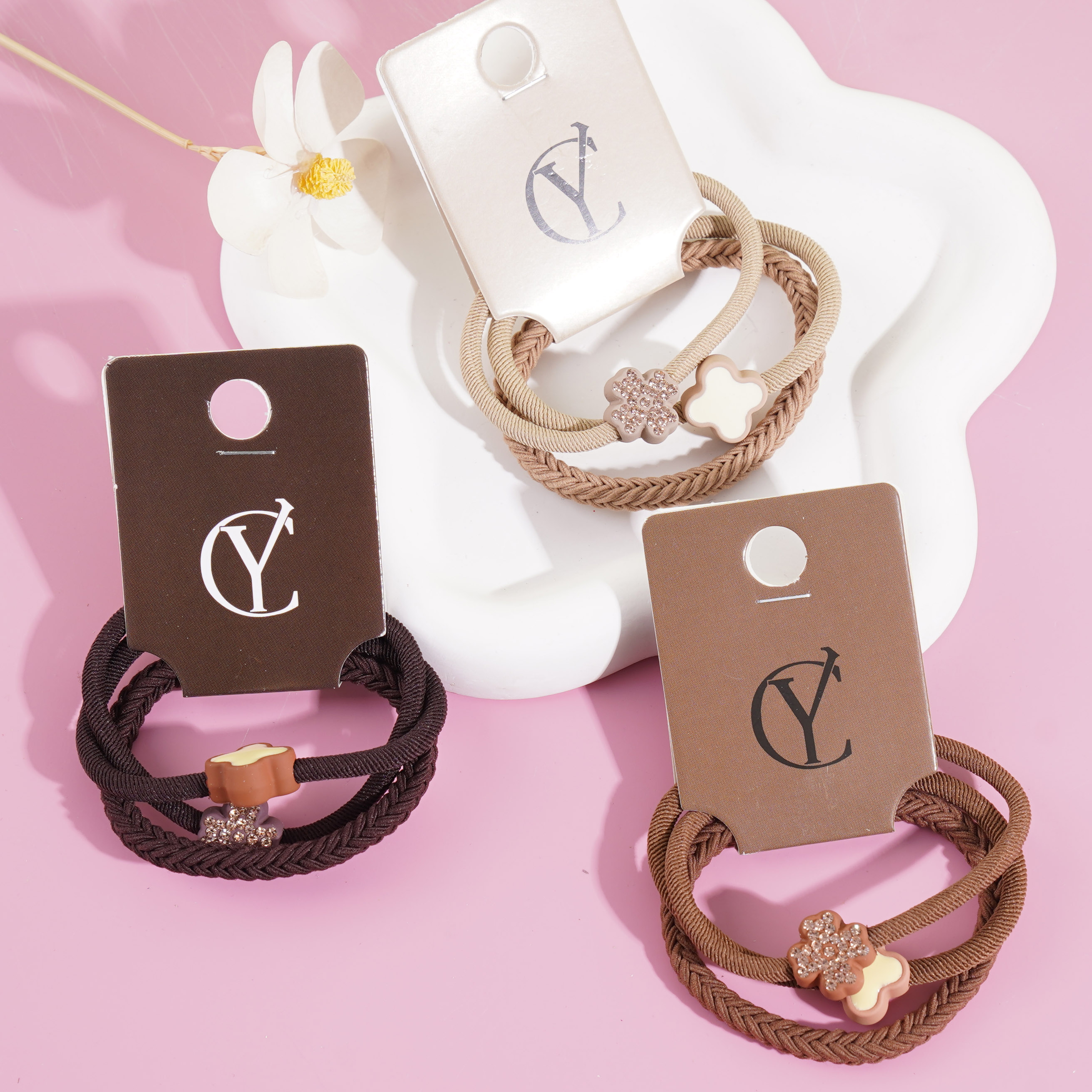 3 sets of four-leaf clover-themed headbands and hair ties