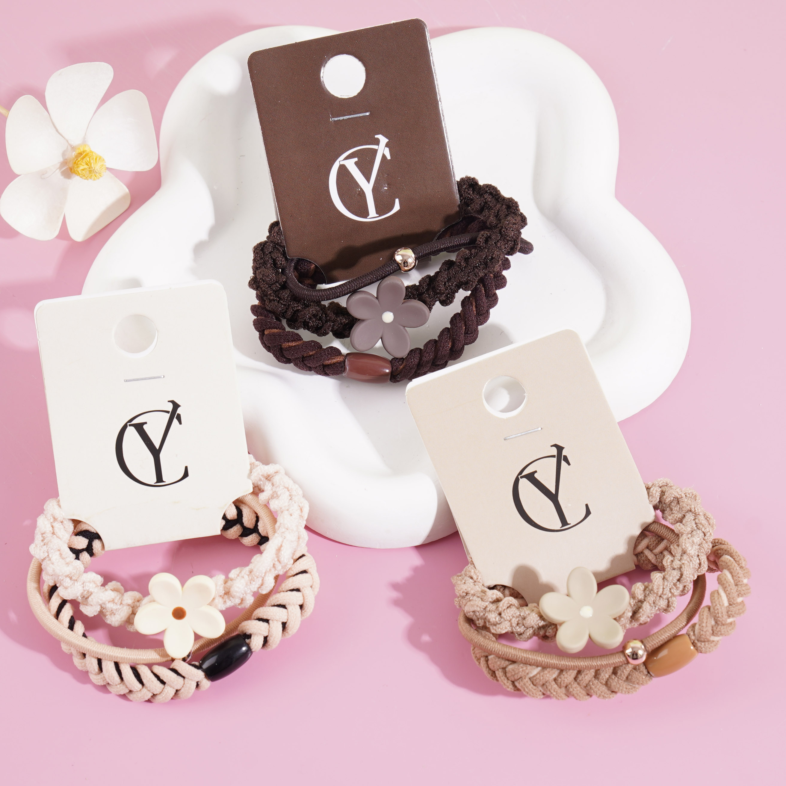 A headband made of three flowers combined with elastic bands