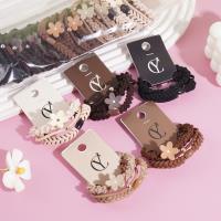 A headband made of three flowers combined with elastic bands