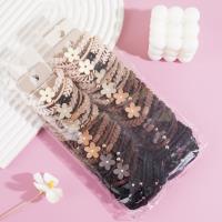 A headband made of three flowers combined with elastic bands