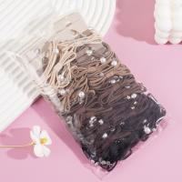 A set of three large pearl bow headbands with elastic bands