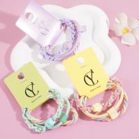 A headband made from three flowers, combined with a rope and a rubber band