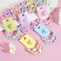 A headband made from three flowers, combined with a rope and a rubber band