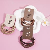 A set of three gold bead star-shaped necklaces, combined with a string of beads and a rubber band as a headband