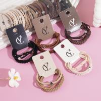 A set of three gold bead star-shaped necklaces, combined with a string of beads and a rubber band as a headband