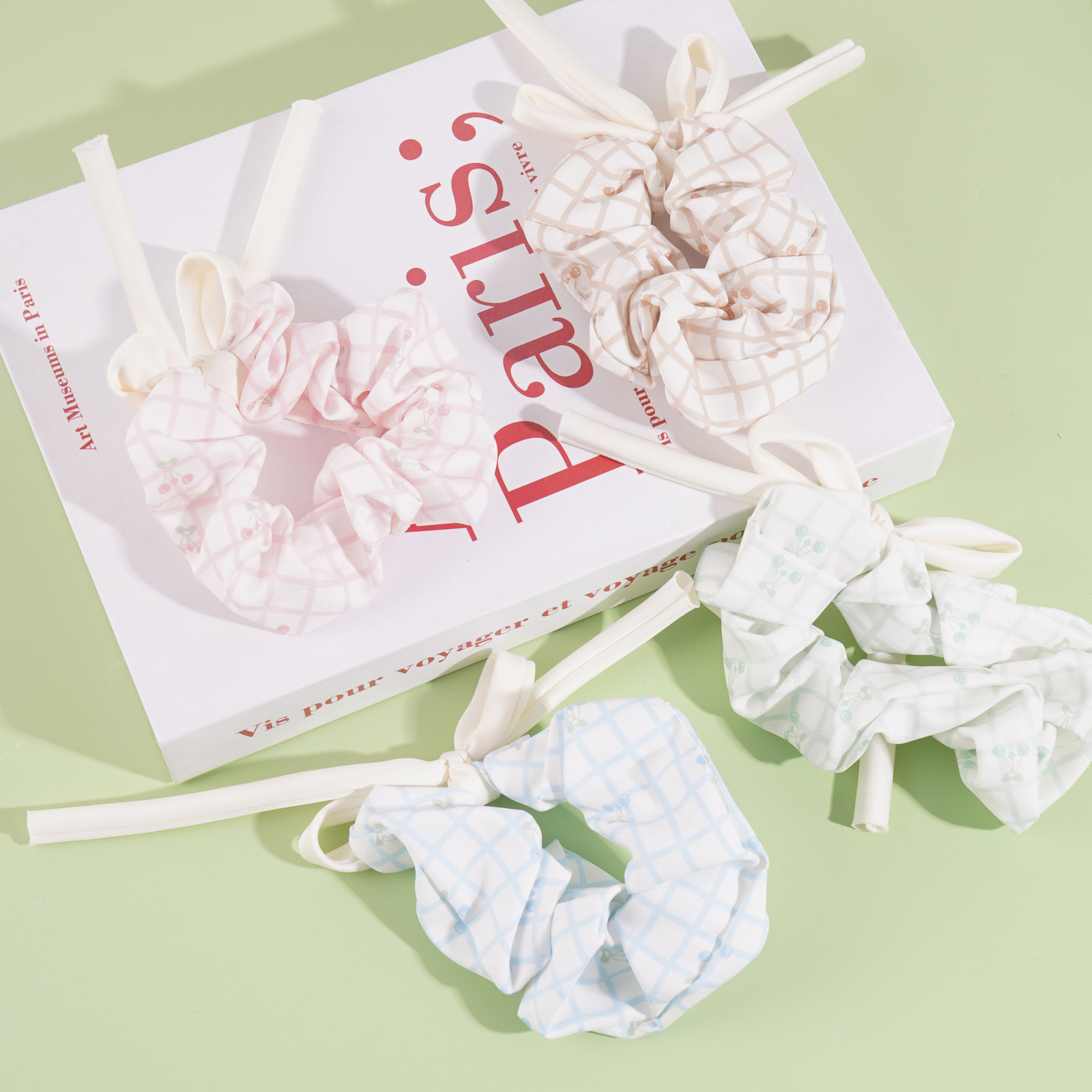 A large butterfly-shaped cherry bow tie with a floral pattern on the collar