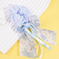 A delicate pearl sausage-shaped ring with a flowing ribbon design