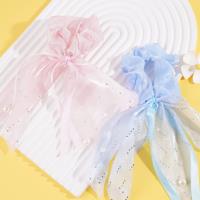 A small diamond pearl intestinal ring pendant with a flowing ribbon design