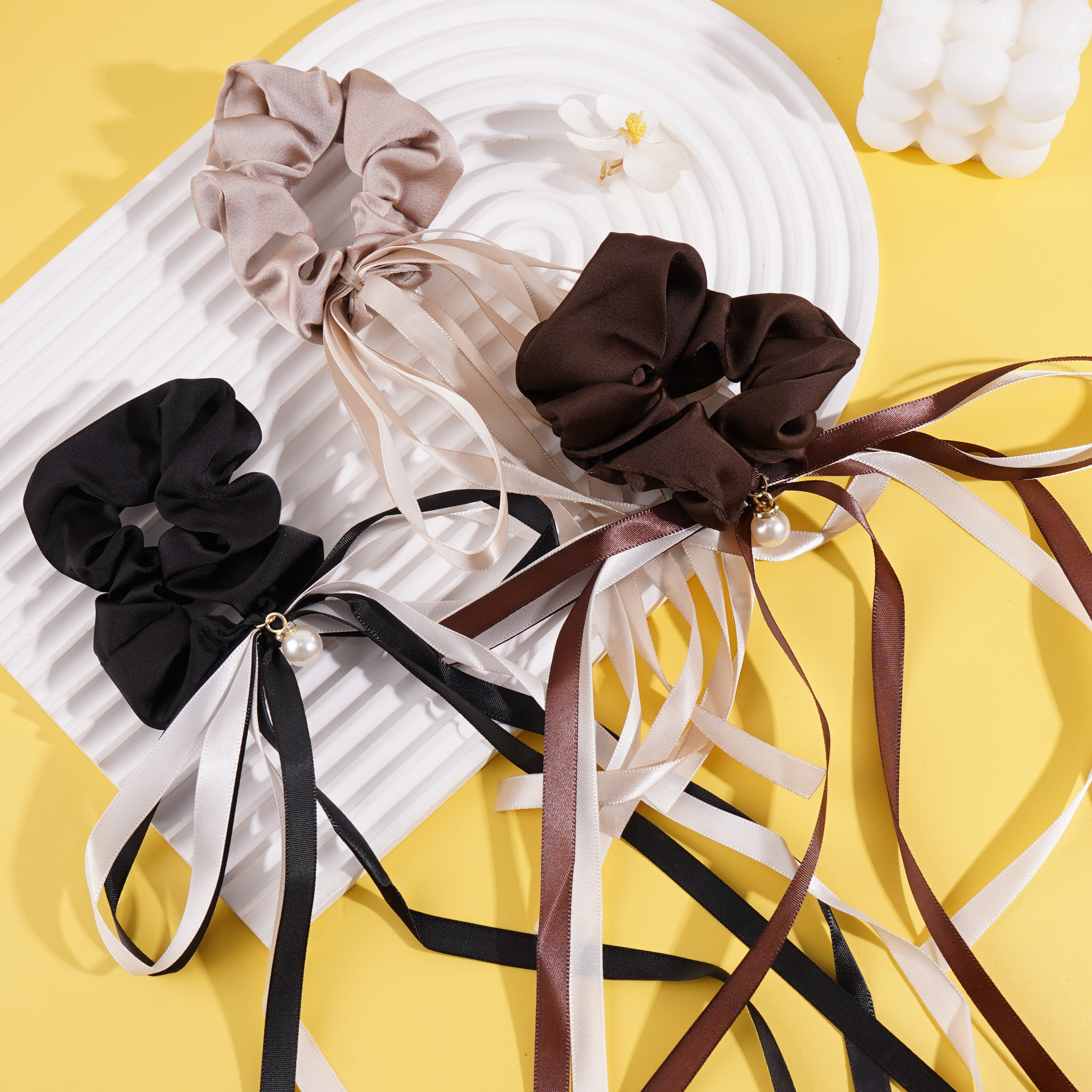 Bow tie, intestinal ring, and long flowing ribbon