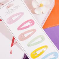 A long strip of cartoon-themed BB-style paperclips with colorful designs