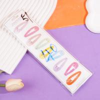 A long strip of cartoon-themed BB-style paperclips with colorful designs