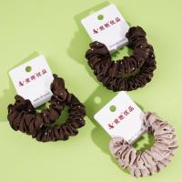 2 pieces of large intestine, marinated with soy sauce, milk coffee sauce, and topped with a rope-like elastic band made from leather