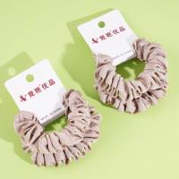 2 pieces of large intestine, marinated with soy sauce, milk coffee sauce, and topped with a rope-like elastic band made from leather